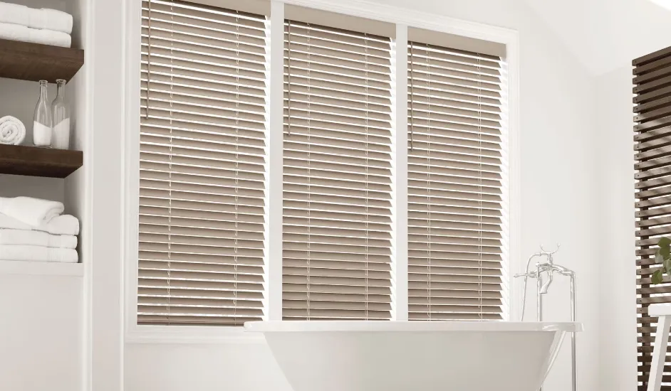 Faux wood blinds for kitchen windows.